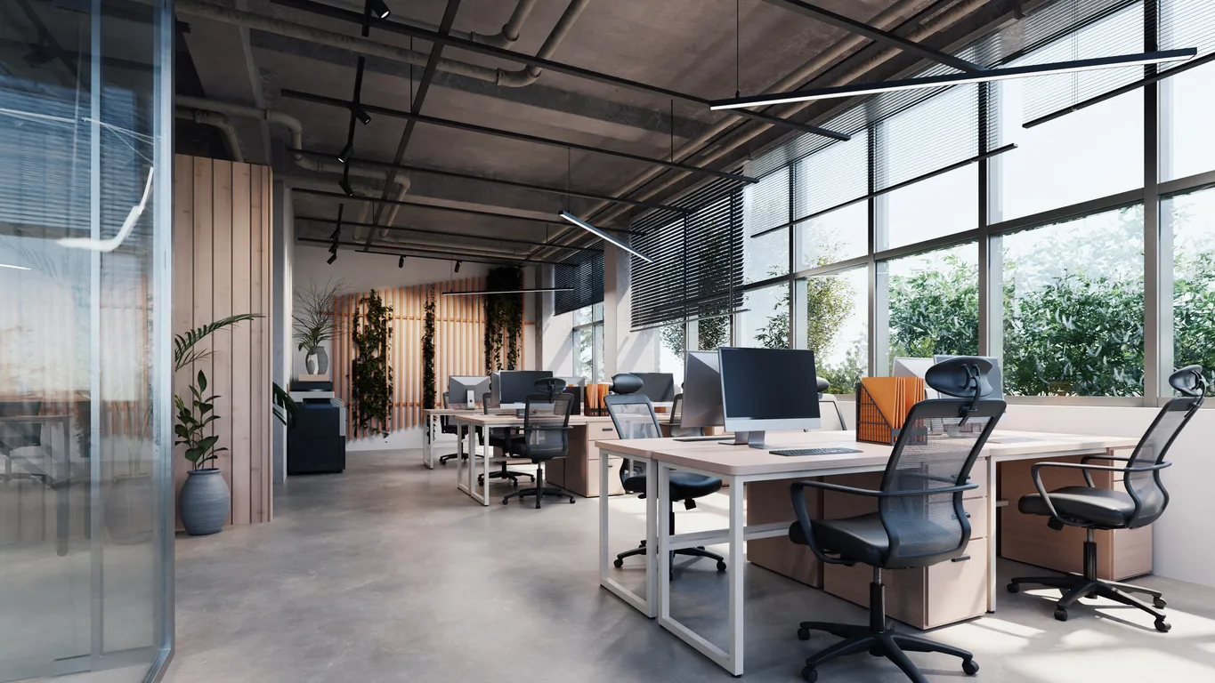 Modernes Büro mit Sichtbetonboden und vielen Pflanzen von Gooltex
